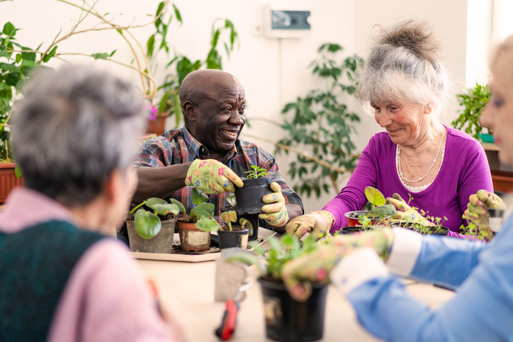 Two elderly patients sitting outside